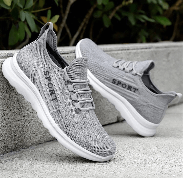 Gray breathable lace-up sneakers with mesh upper, perfect for men seeking comfort and style, showcasing the 'Sport' design on the side.